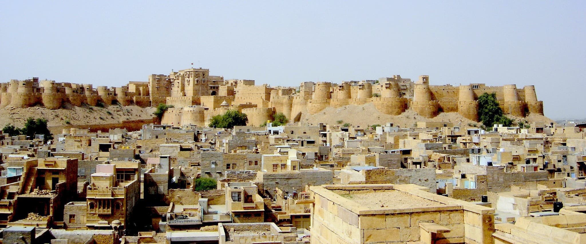 Golden sandstone fort glowing at sunset in Jaisalmer
