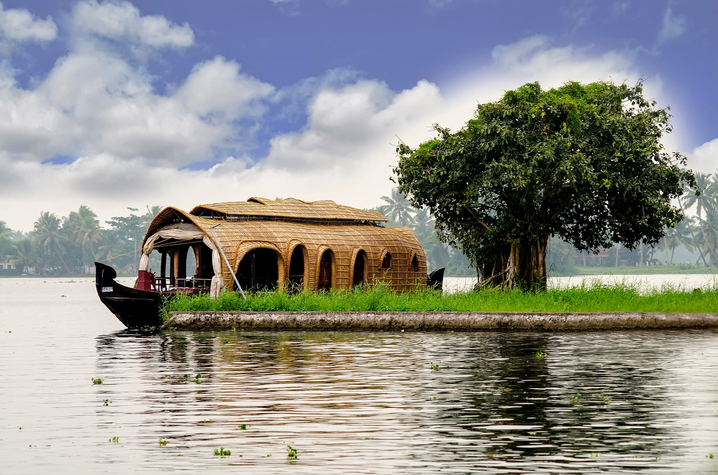 Traditional houseboat cruising through Kerala backwaters