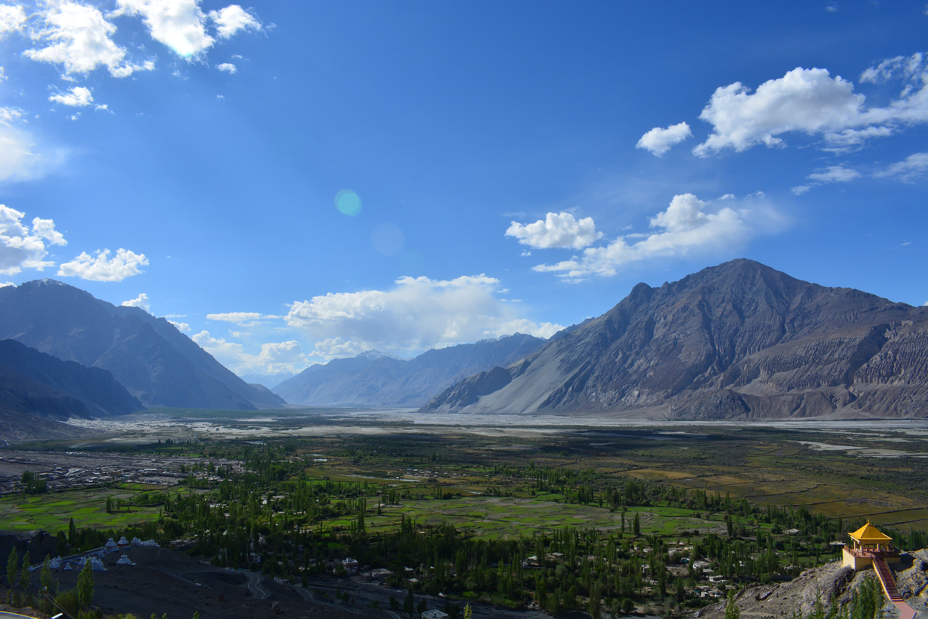 Barren high-altitude Ladakh landscape under a blue sky